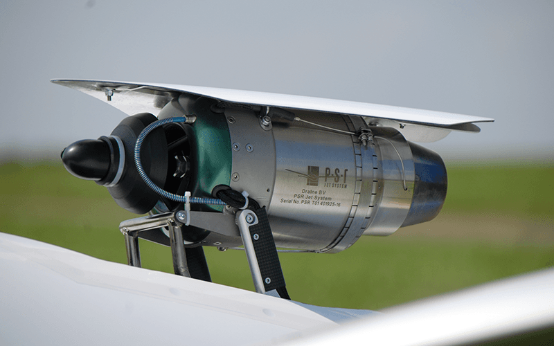 A high-performance brushless electric motor and carbon-fiber propeller mounted on a thrust test stand